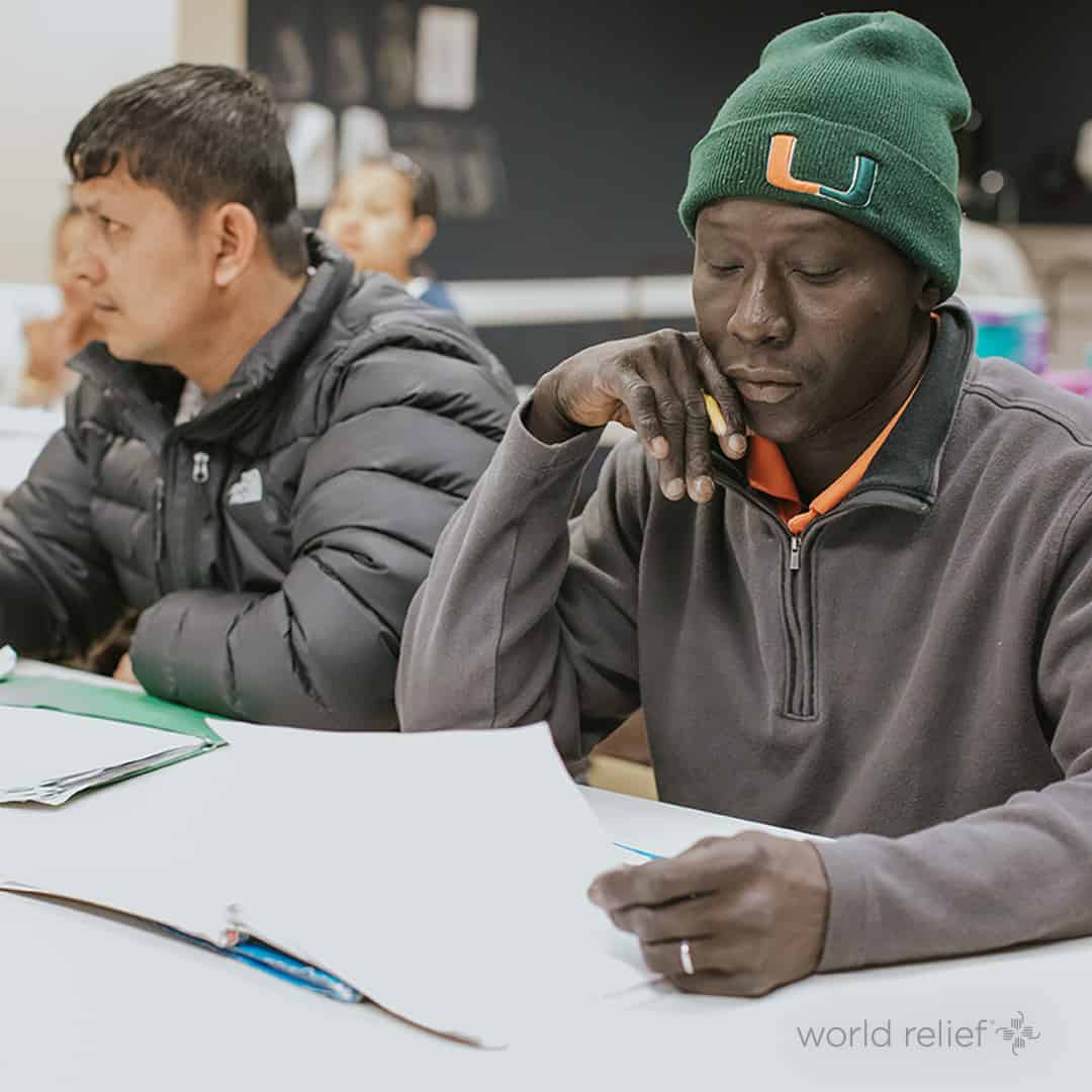 two men learning in employment class