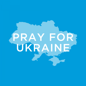blue graphic with light blue imprint of Ukraine country with words Pray for Ukraine on foreground