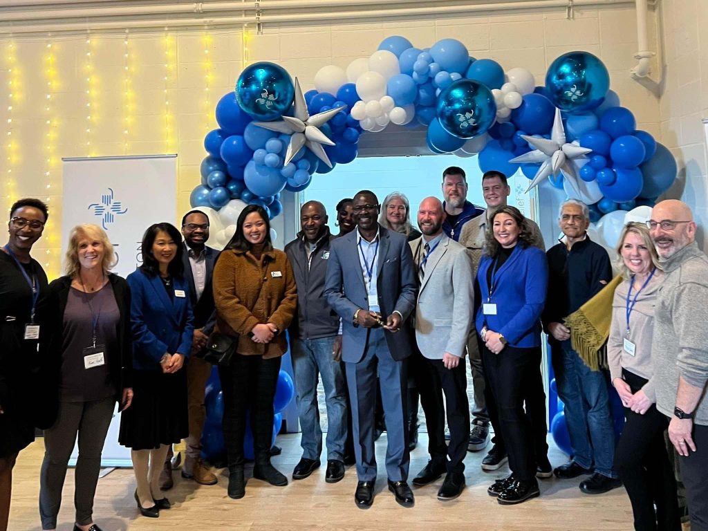 Staff celebrate the opening of a new location in Thurston County. Together, they're helping write new stories for immigrants in Western Washington.