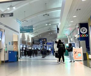 The family gathers in the airport for the first time in six years.