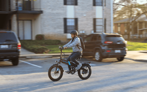 Photo of a man riding a new electric bike
