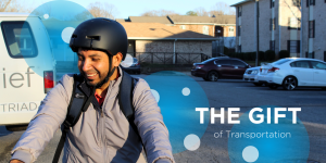 Picture of a man smiling on an electric bicycle