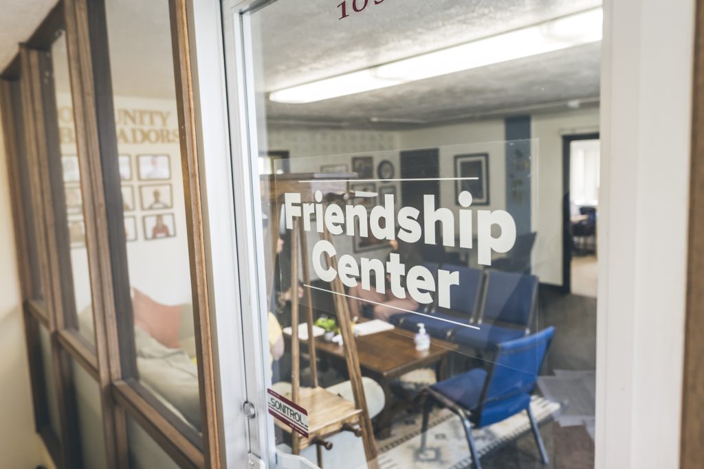 Mely talks to clients in the Friendship Center