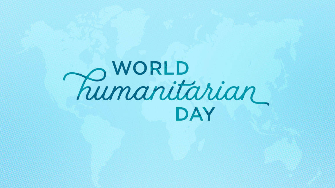 World Humanitarian Day written in script on a light blue map background