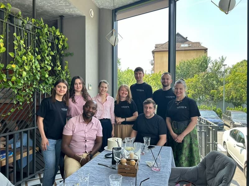 The World Relief Ukraine team enjoys a meal together