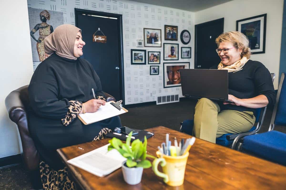 Former refugee meets with World Relief extended services case manager.