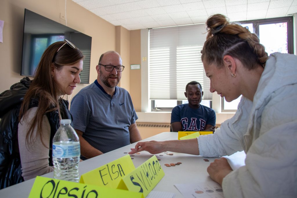 English Conversation Club participants counting money