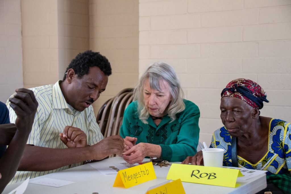 English Conversation Club participants counting money