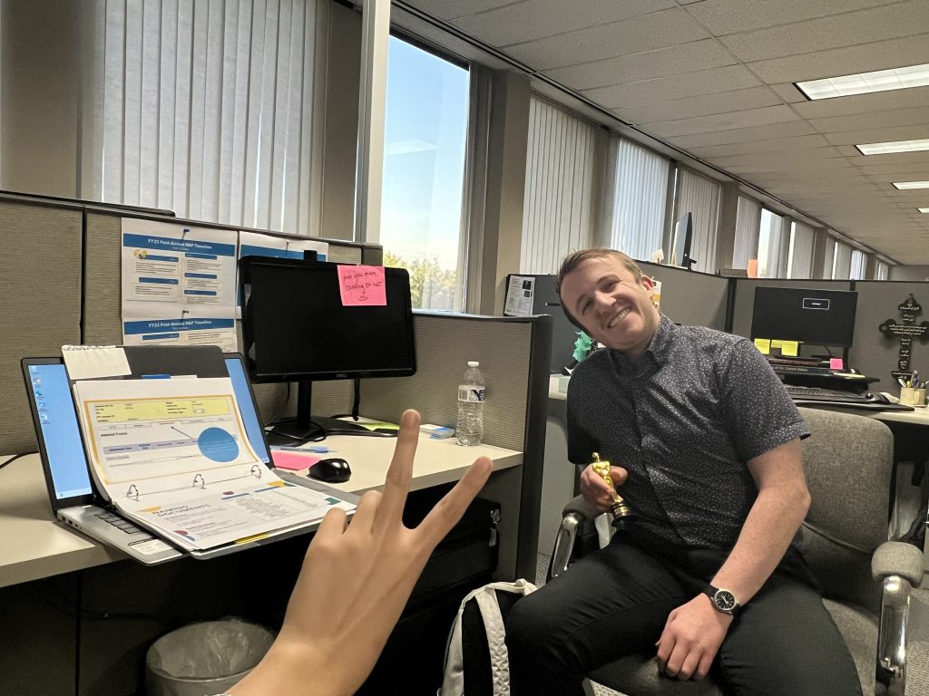 Resettlement Associate Eric Pristupa working with intern Gulzar Shamurzaeva to connect with family reunification applicants in RIF and Lautenberg programs.