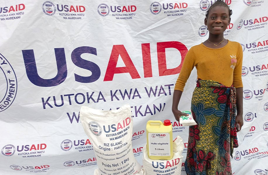 Setia, one of millions impacted by displacement in DR Congo, receives food for her family from World Relief in partnership with USAID. 