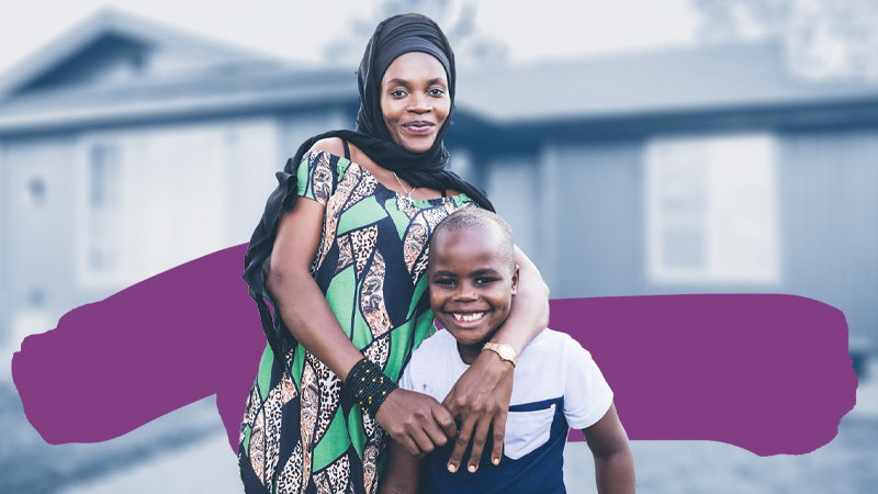World Relief 2024 Annual Report: A refugee mother from DR Congo stands with her arms around her son in front of their home in Washington state.