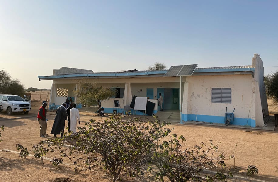 Nadiwa's refugee story - patients arrive at a health facility in a refugee camp