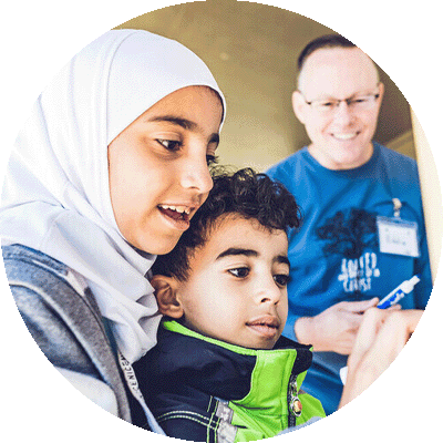 gift-guide-children-youth-tutoring two children being tutored