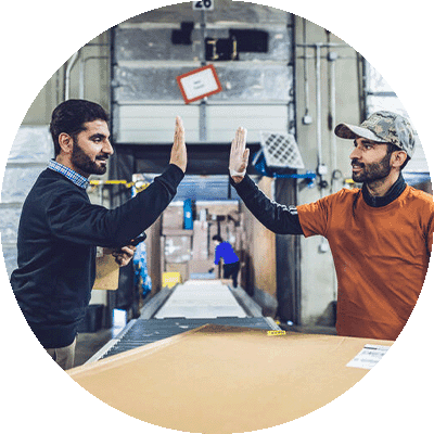 gift-guide-economic-empowerment-job-training Two people high fiving