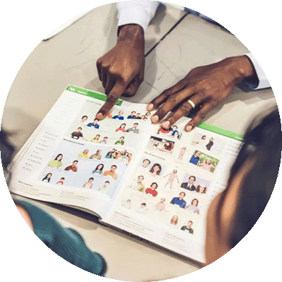 gift-guide-gh-adult-ed-workbooks hands pointing to the contents of a workbook