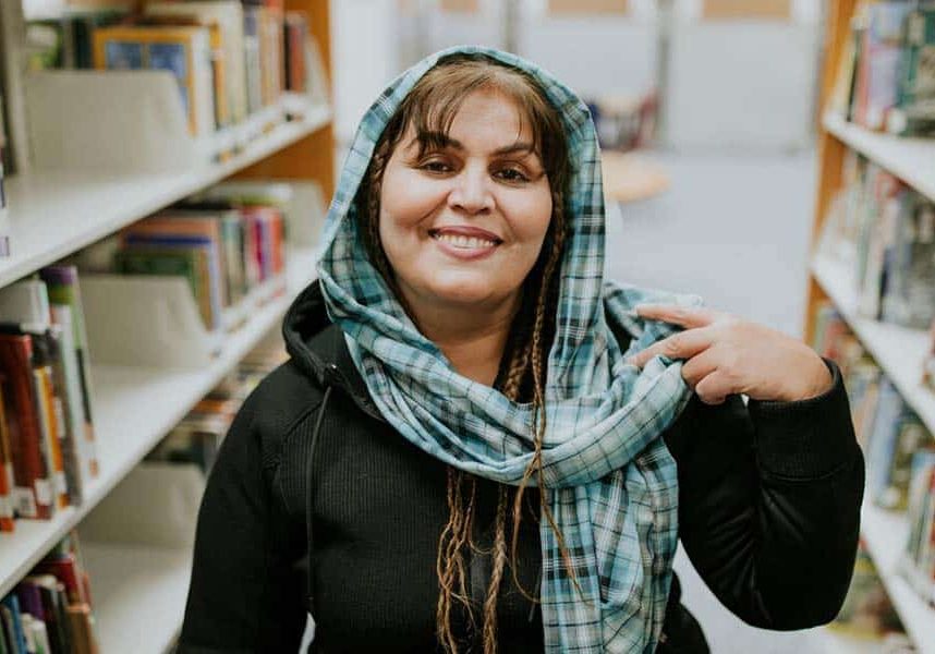 Aqlima, an Afghan client with World Relief Fox Valley, works as a librarian at an elementary school.