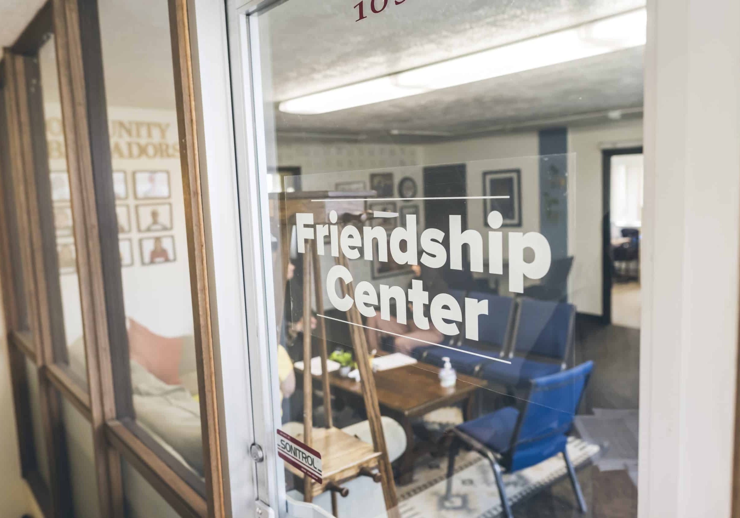 Mely talks to clients in the Friendship Center