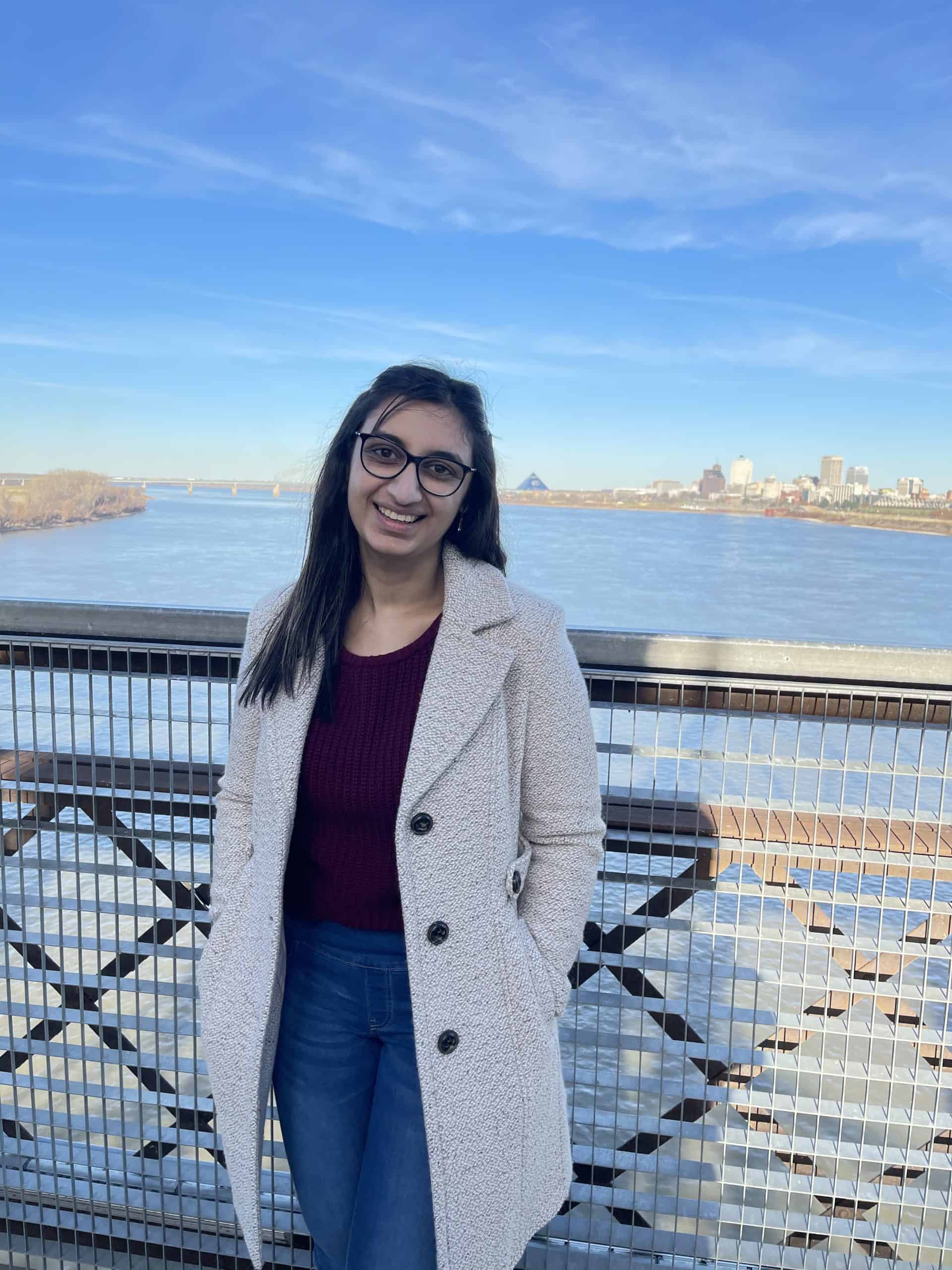 Spring intern Madiha on the Memphis bridge.