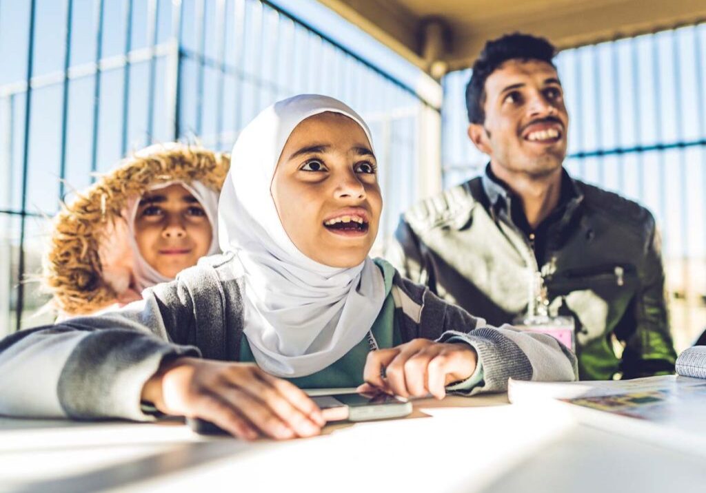 A father with his children participate in an ESL class with World Relief in Texas.