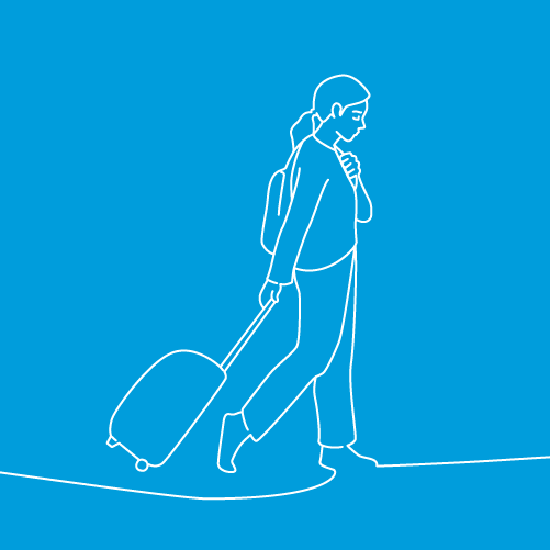 A women carries bags and is walking somewhere