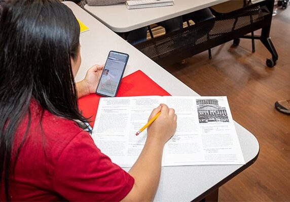 A woman studies for her citizenship test